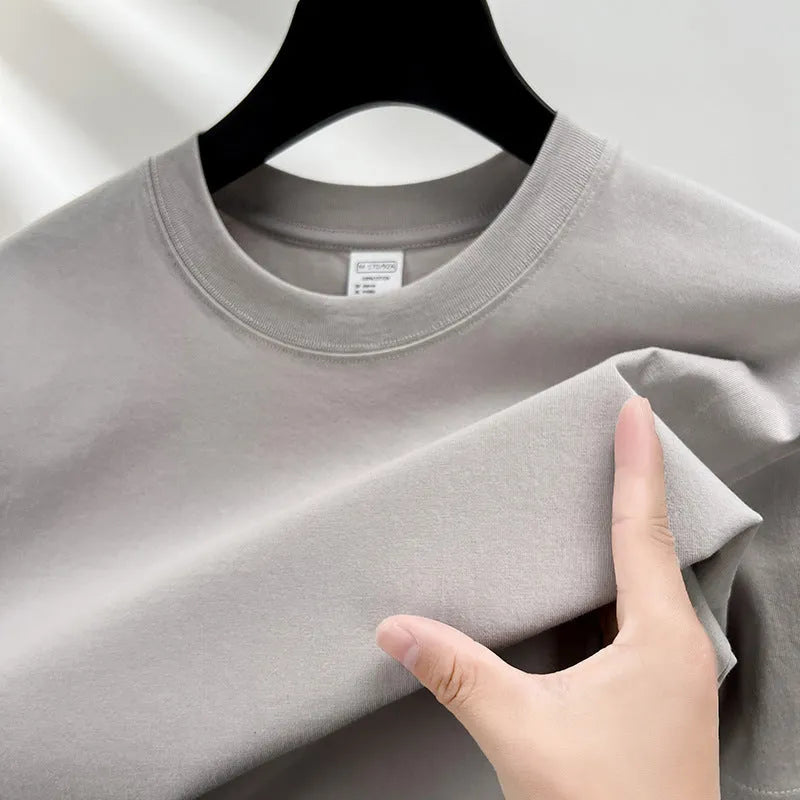 Men's drop shoulder solid colour cotton T-shirt in white, front view, short sleeves, relaxed fit