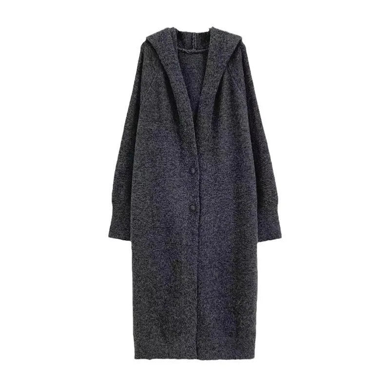 Woman wearing a long, loose, hooded knitted cardigan in a neutral colour, Korean casual style.