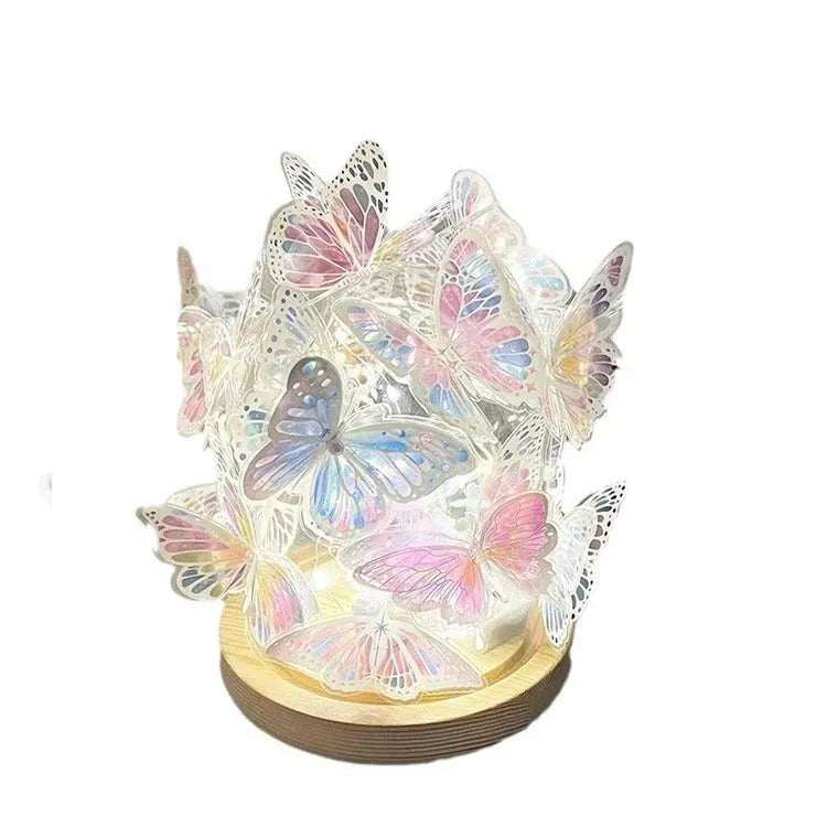 Butterfly night light with glass shade on raw wood base, measuring 12x15cm