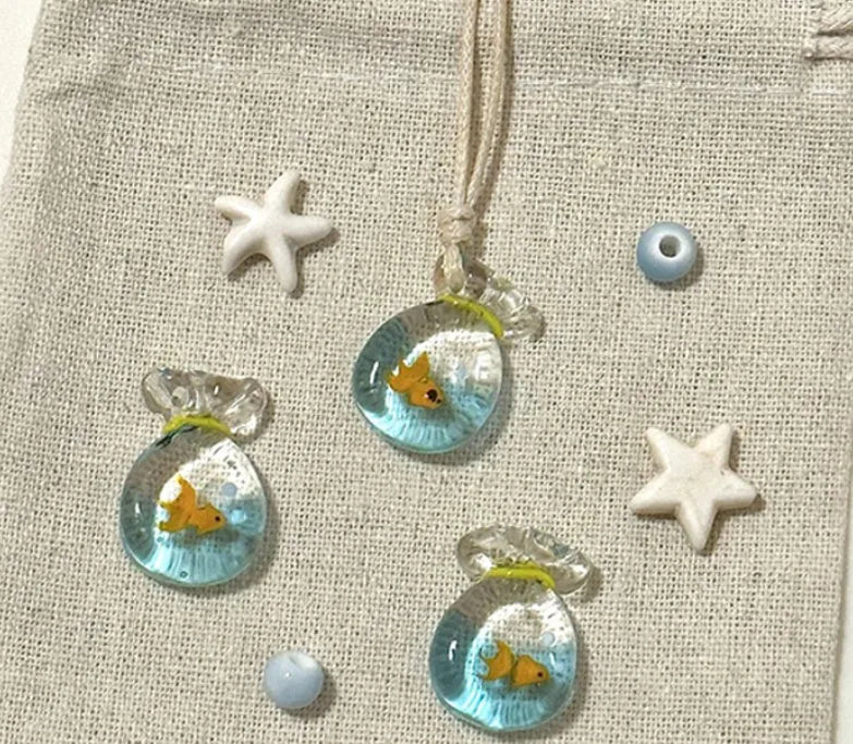 Women's necklace with a coloured glaze Joker pendant wearing a skirt on a cotton and linen chain.