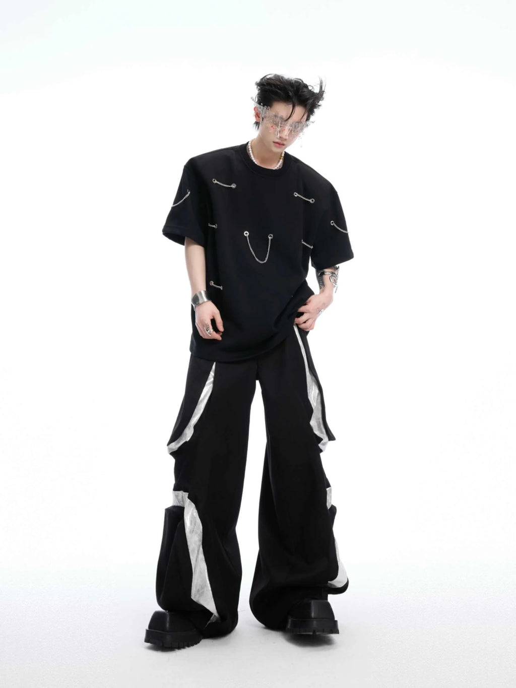 Black short sleeve T-shirt with metal chain detail on padded shoulders, round neck, heavy cotton fabric
