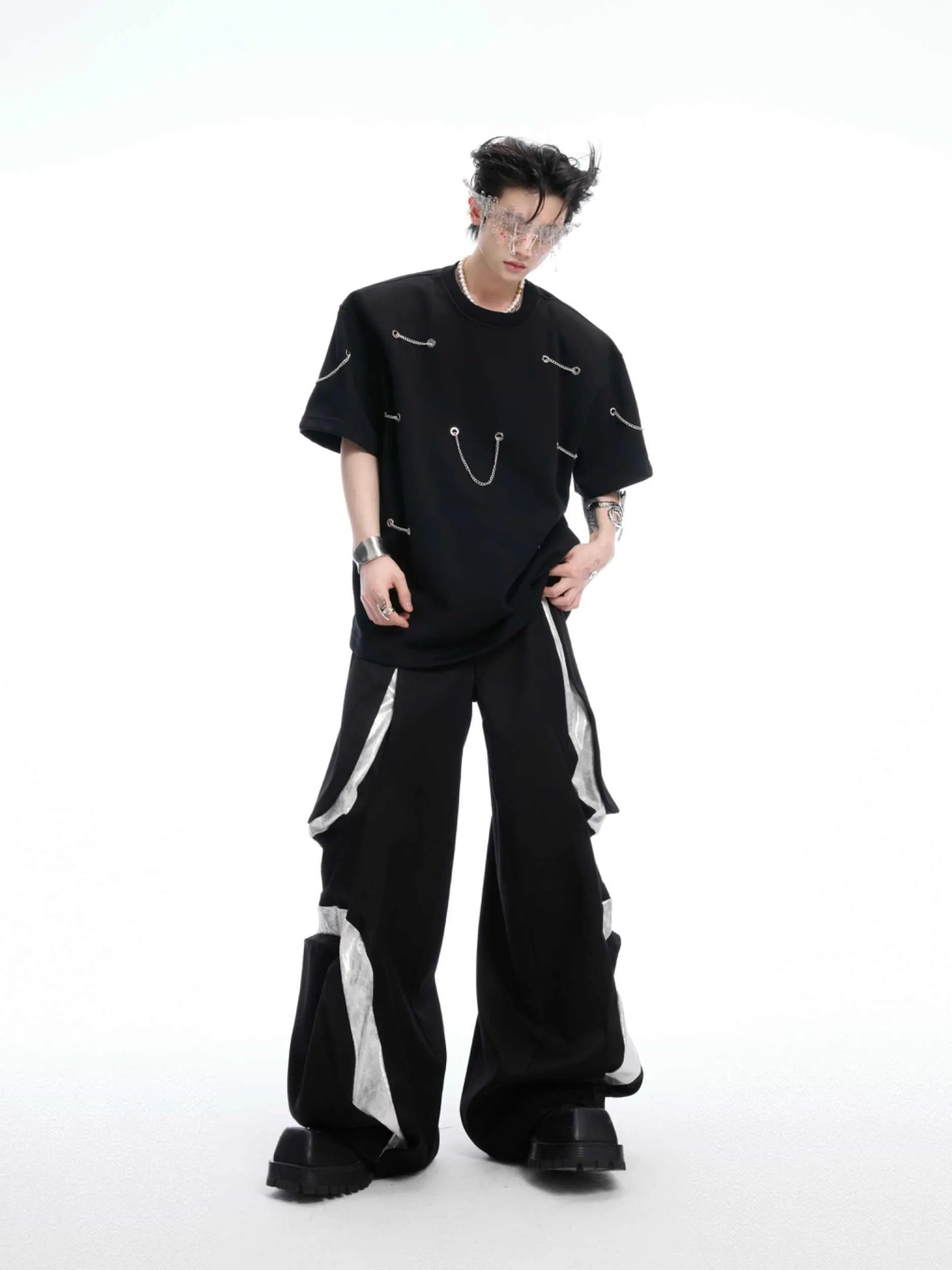 Black short sleeve T-shirt with metal chain detail on padded shoulders, round neck, heavy cotton fabric