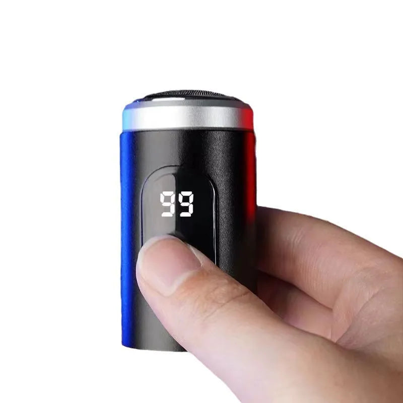 Black mini USB rechargeable shaver with LED display, shown with charging cable and cleaning brush.