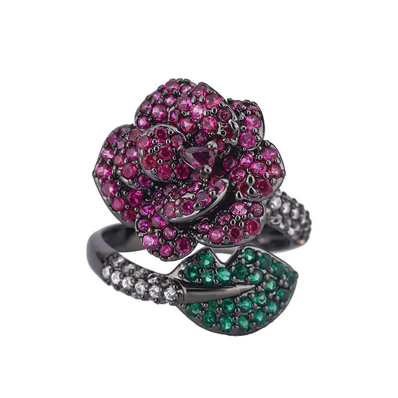 Black gold geometric flower ring with red simulation stones on gold-plated copper band
