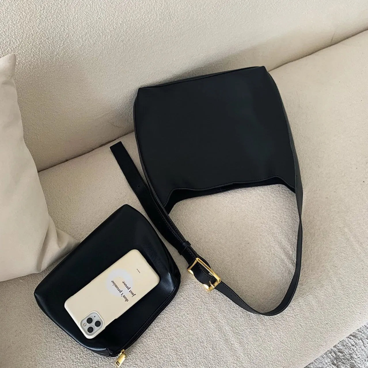 Women's black PU leather shoulder bag with swing thread design and adjustable strap