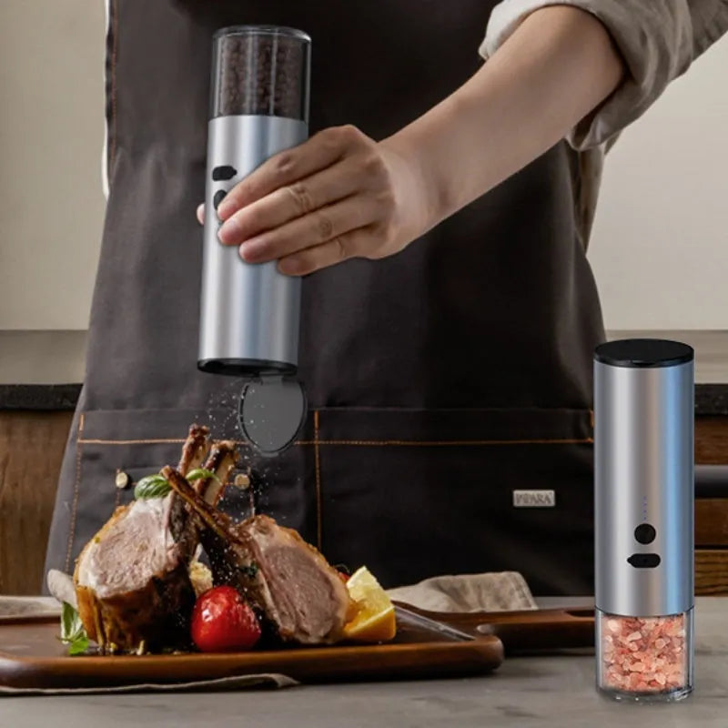 Rechargeable electric pepper and salt grinder with LED light and stainless steel top on white background