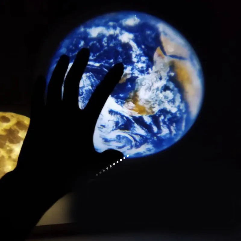 A 2 in 1 earth and moon projection lamp with a flexible hose bracket on a table