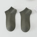 Solid colour low-cut polyester boat socks for men displayed in multiple colour options.