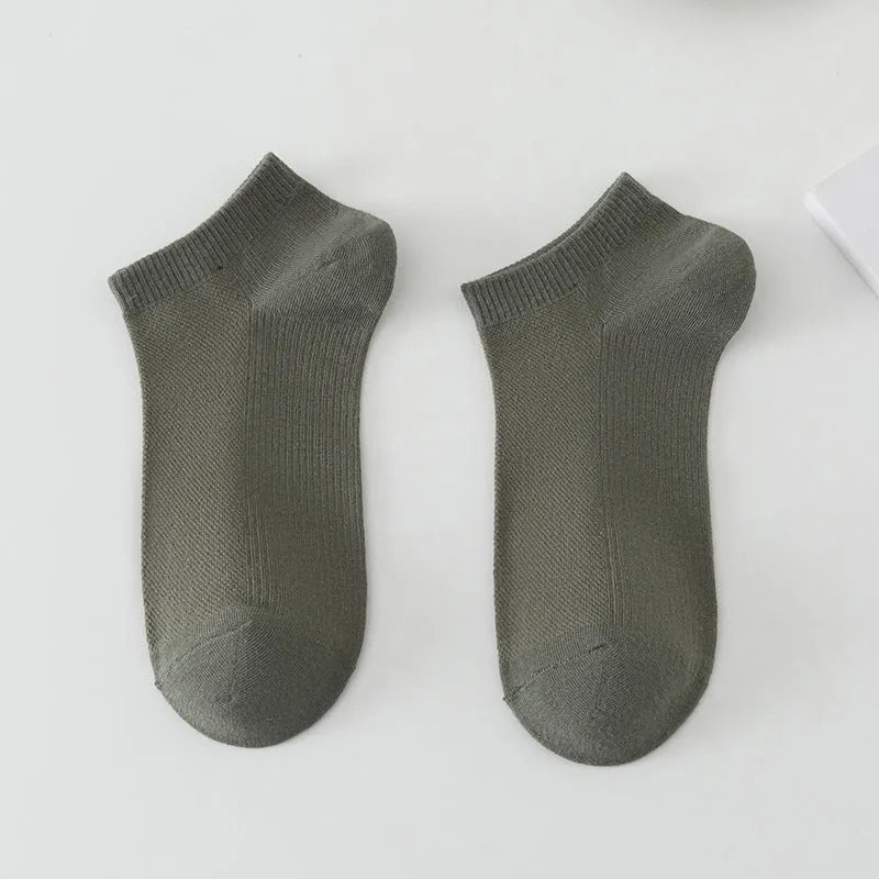 Solid colour low-cut polyester boat socks for men displayed in multiple colour options.