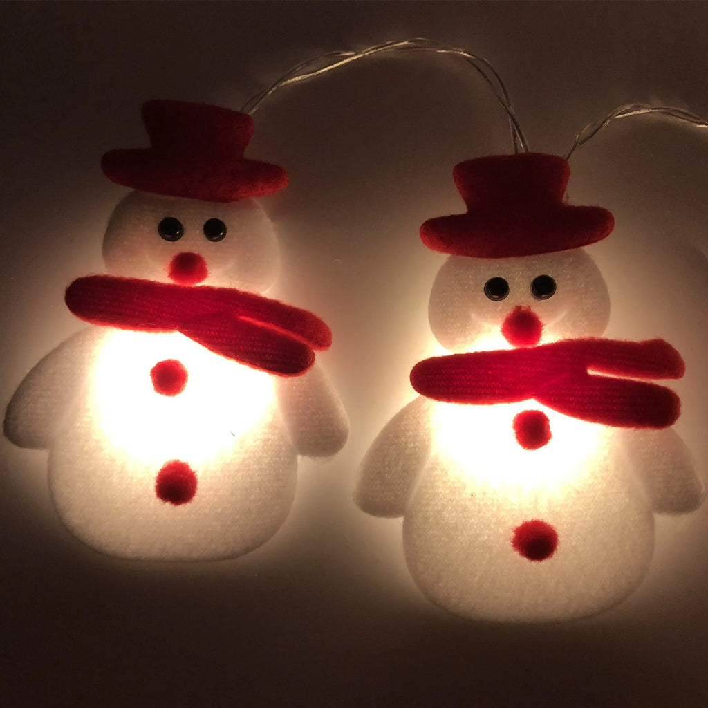 Snowman LED string lights garland with warm white glow on a Christmas tree