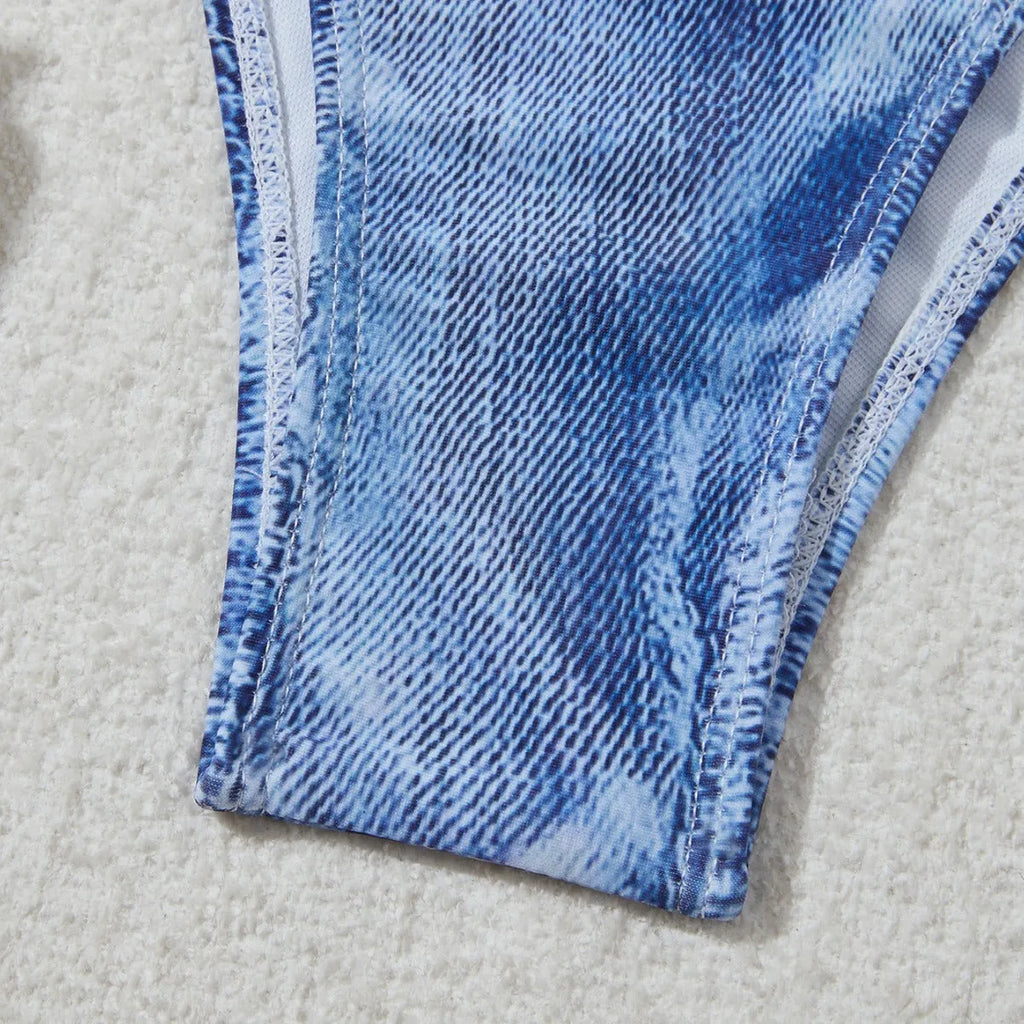 Women's denim blue printed bikini set with strap design, shown as a two-piece swimsuit.