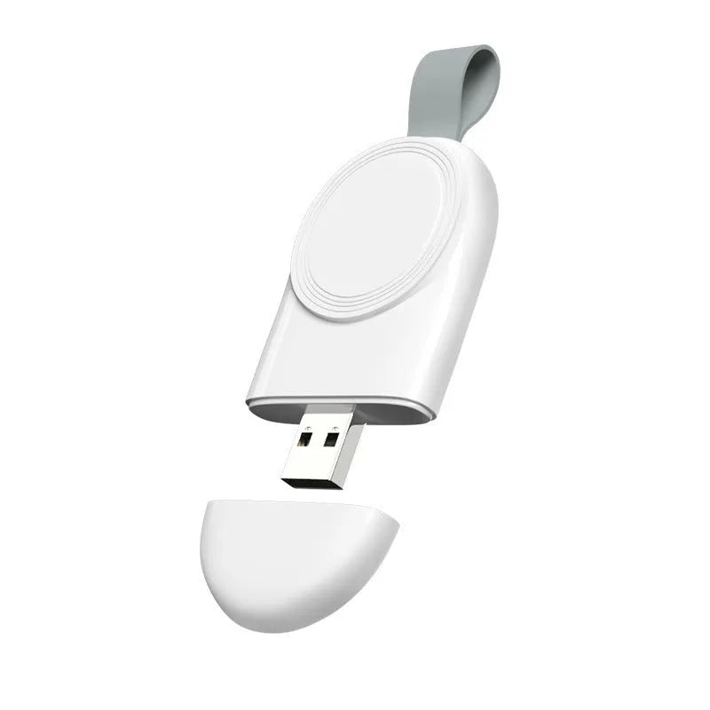 Portable wireless Apple Watch charging dock in white on a desk, with USB cable attached