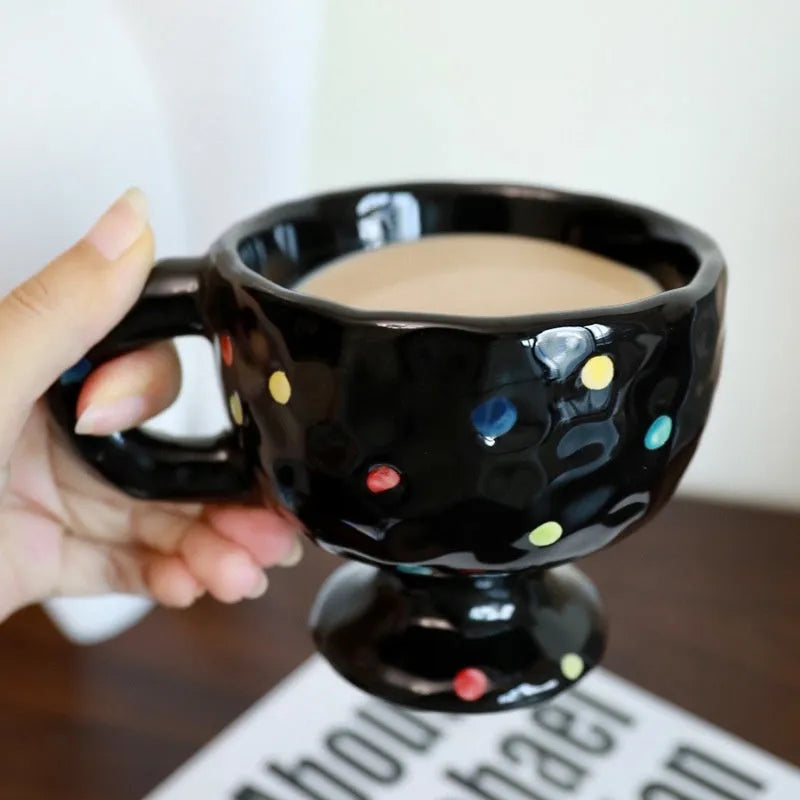Hand-pinched irregular shaped ceramic mug in solid colour with 250ml capacity
