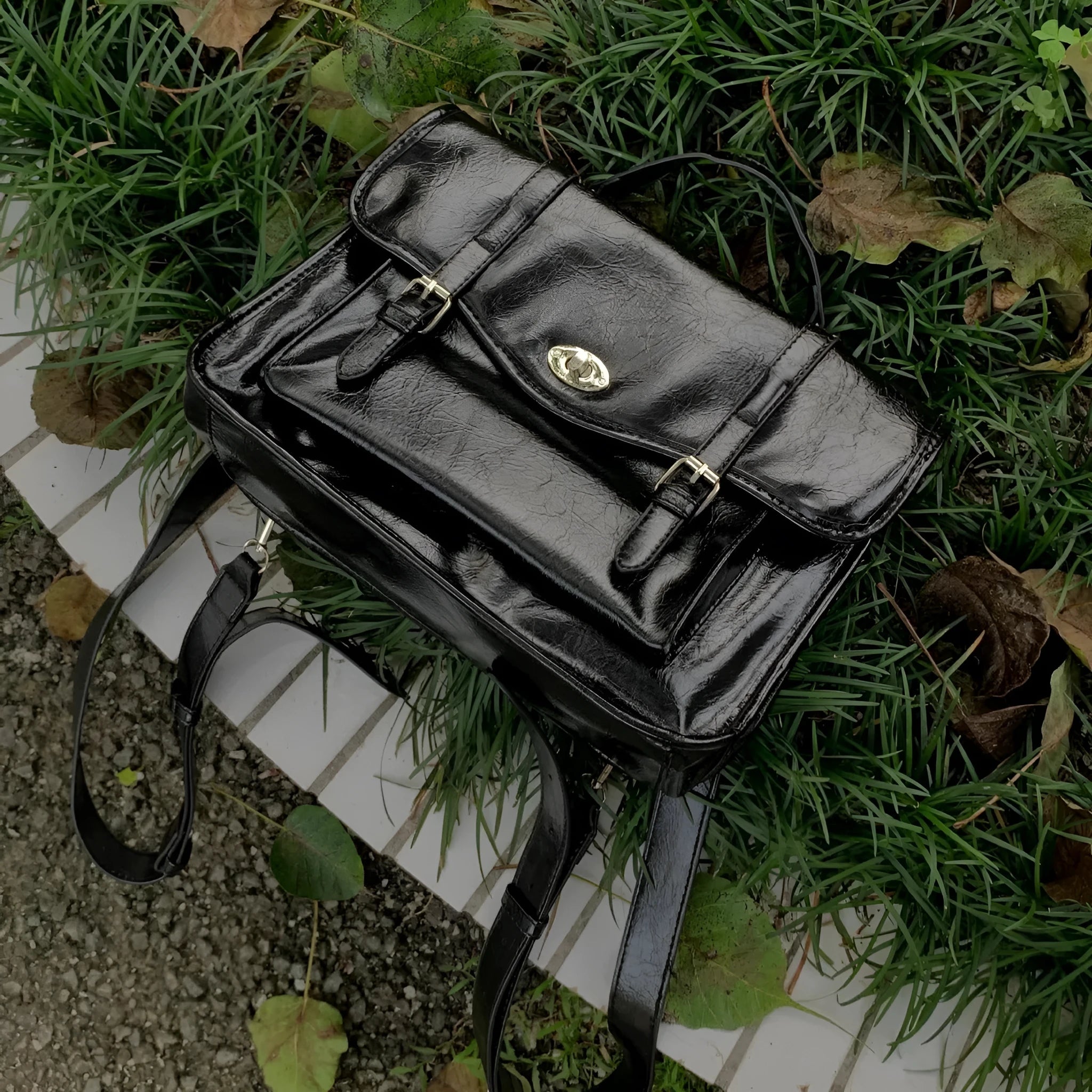 Black oil wax PU leather messenger bag with adjustable shoulder strap showing 35cm length