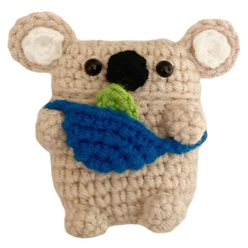 Hand-knitted koala bear backpack design cover for Apple AirPods charging case on a white background.