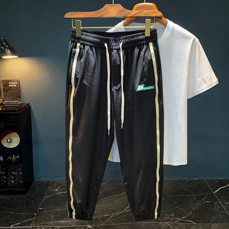 Men's black cotton harem trousers with elastic mid waistband and full length design for casual sports wear