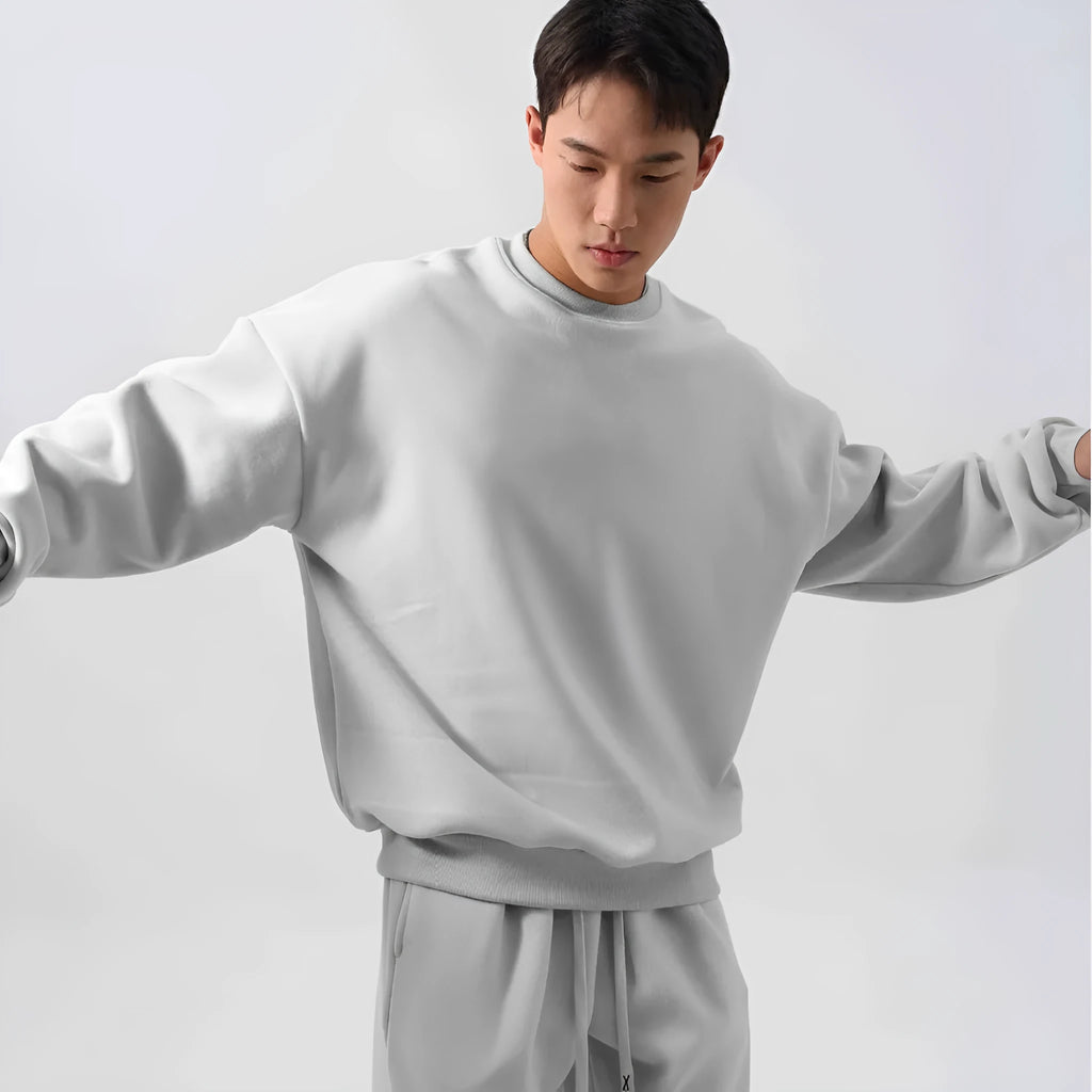 Men's loose fit polar fleece sports suit in winter colours, showing coat and trousers.
