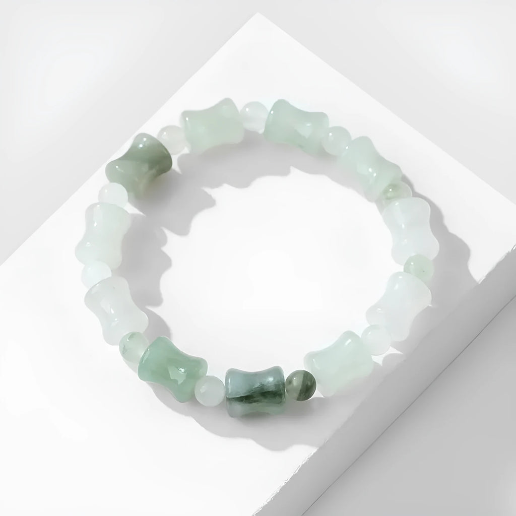 Tianshan Emerald natural chalcedony beaded bracelet with diamond jade centre and coconut shell beads on a white background