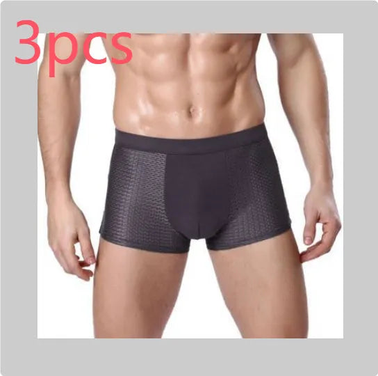 Men's solid colour ice silk boxer briefs with U convex design on a mid-waist.