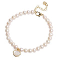 Women's freshwater pearl bracelet with fan-shaped design and alloy shell clasp, showing elastic string and extension chain options.