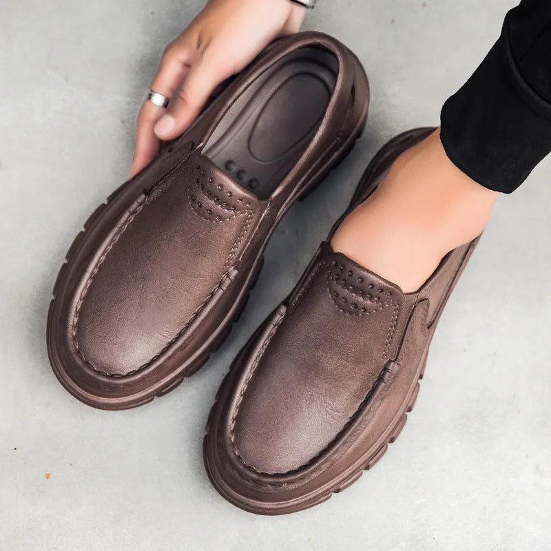 Men's slip-on work shoes in black with waterproof platform sole and mid heel, side view