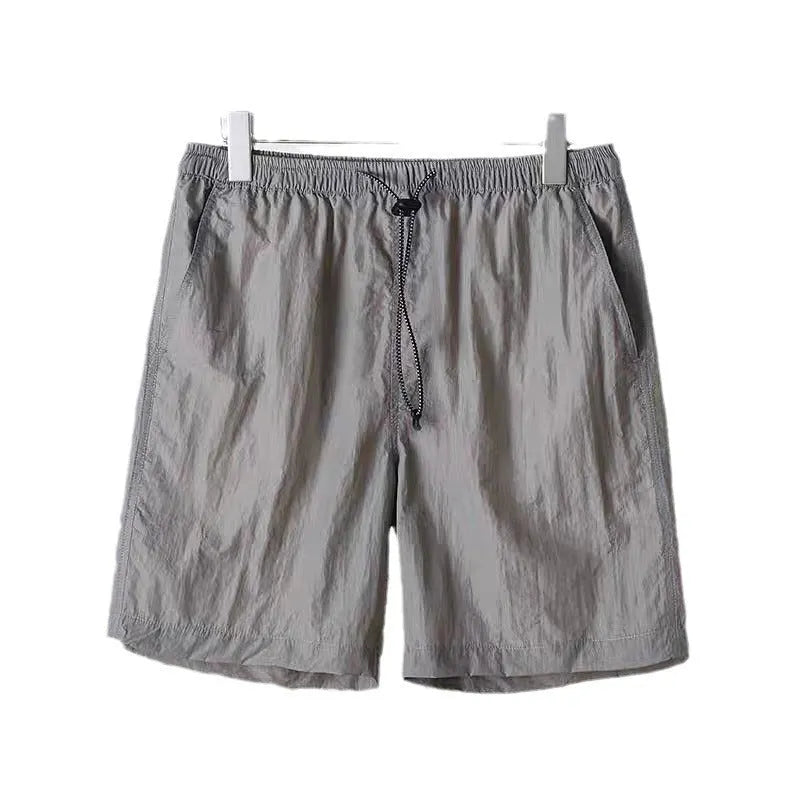 Men's quick-drying polyester sports shorts in 236 blue, straight-leg cut, side view