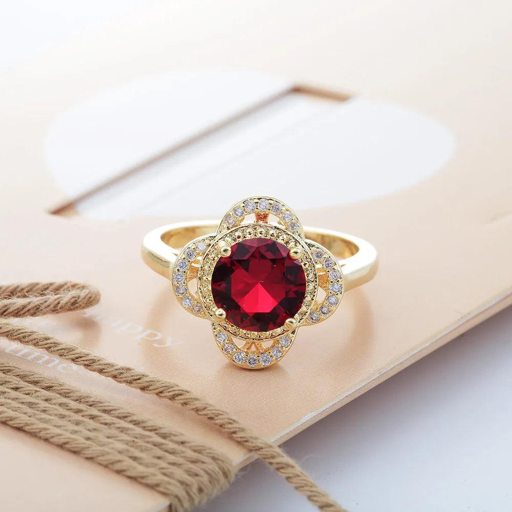 Copper fruit-shaped zircon ring for men and women on a plain background.