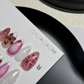 Hand-painted 3D nail patches with embossed candy patterns in almond shape on plastic armour suit