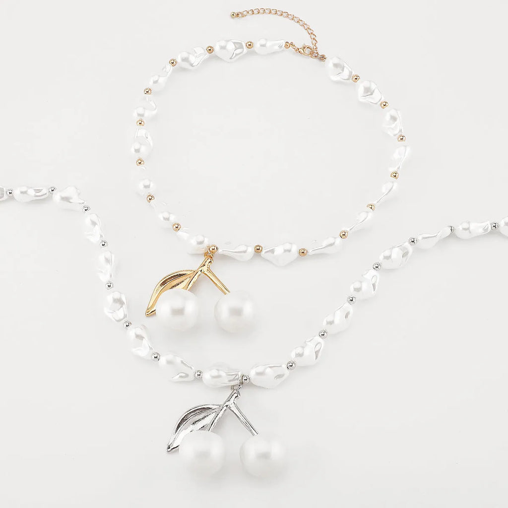 Women's adjustable pearl cherry fruit necklace with gold electroplated finish showing fruit pendant details