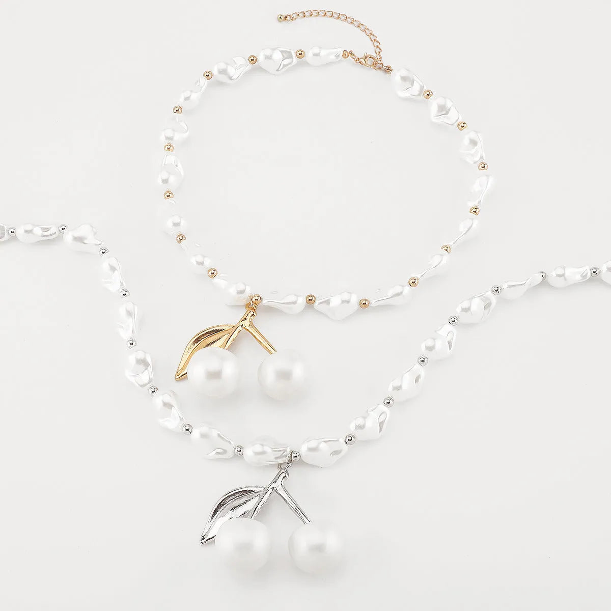 Women's adjustable pearl cherry fruit necklace with gold electroplated finish showing fruit pendant details