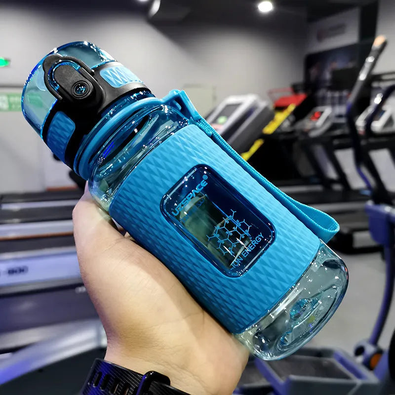 Portable sport water bottle in blue, copolymer polyester plastic, 1100ml capacity, with black cap.