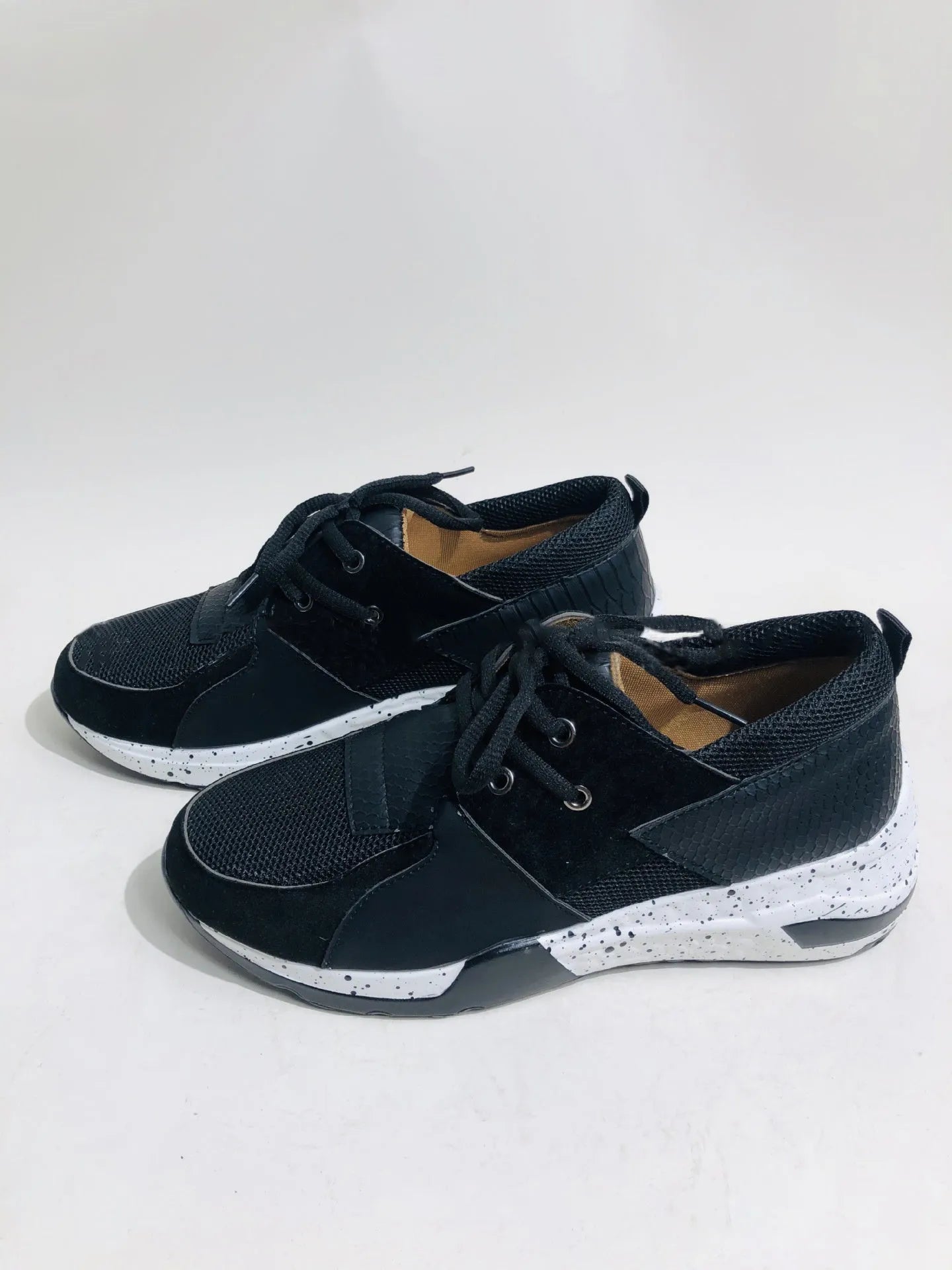 Women's suede casual sneakers with a wedge heel in leopard print colour.