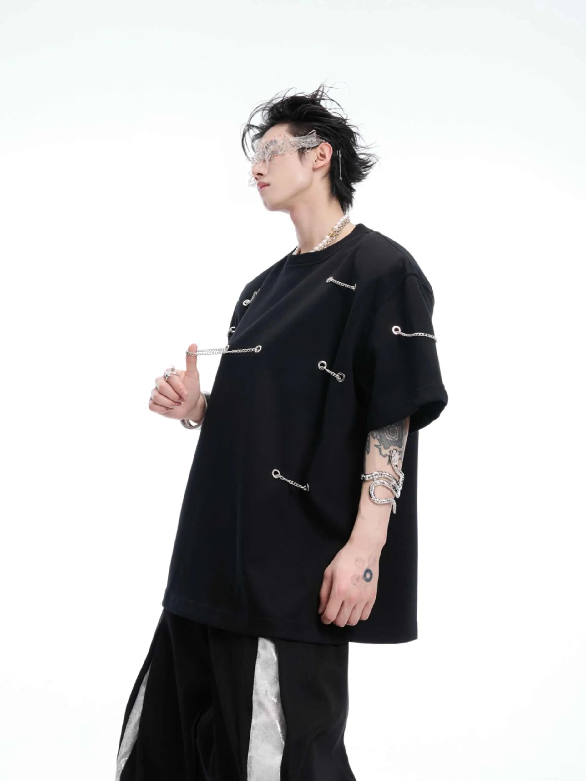 Black short sleeve T-shirt with metal chain detail on padded shoulders, round neck, heavy cotton fabric