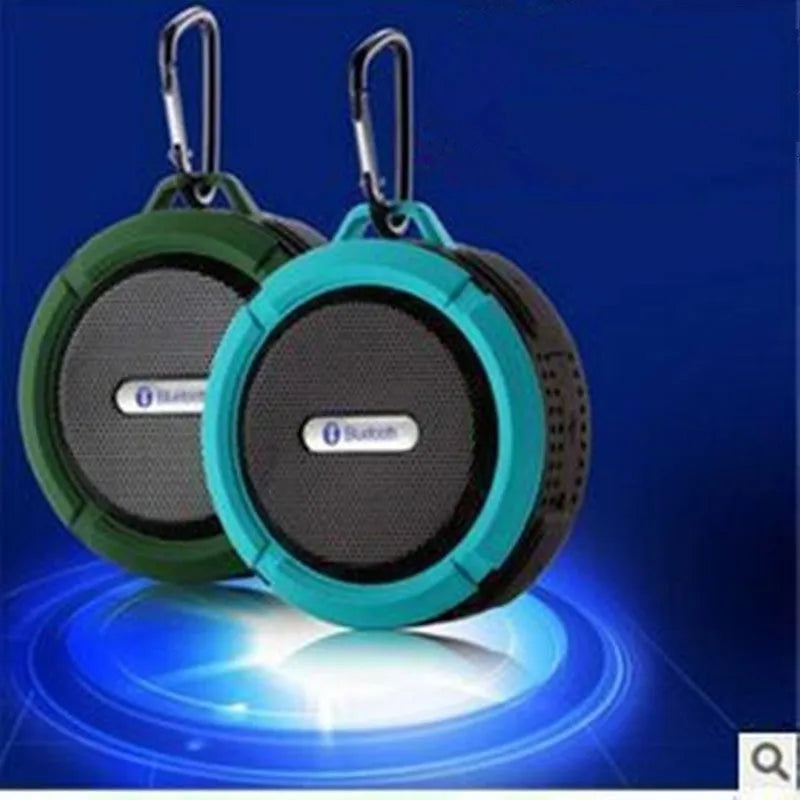 Portable waterproof Bluetooth stereo speaker in plastic housing with mountaineering buckle, available in multiple colours