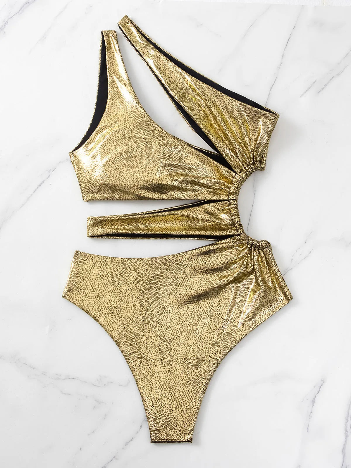 Women's gold backless one-piece swimsuit with sleeveless design