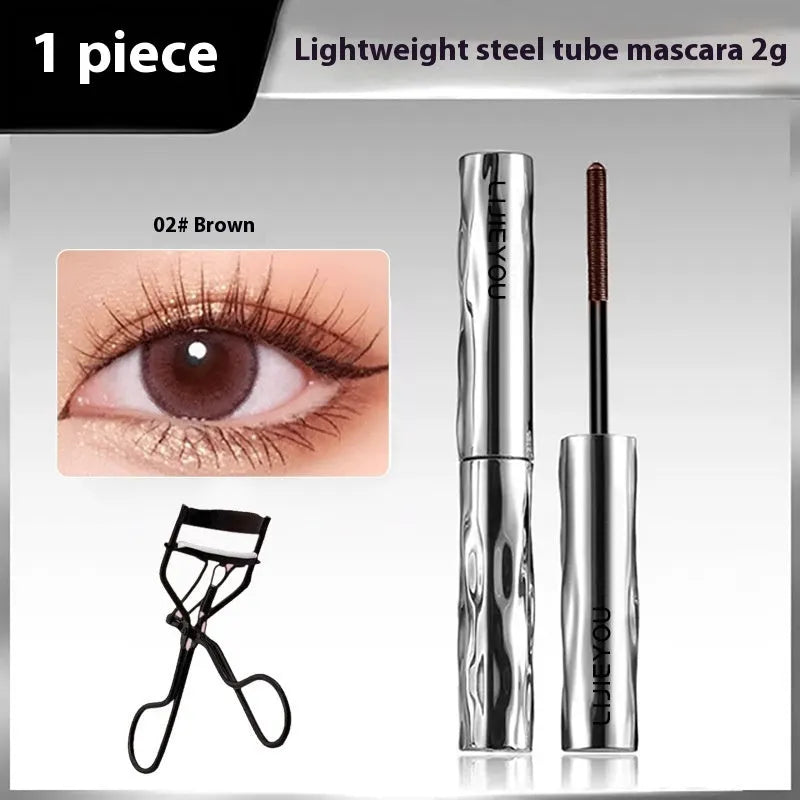 Steel tube waterproof mascara in black and brown shades shown with an eyelash curler.