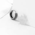 Silver titanium steel geometric twist earrings with round sports-style elements