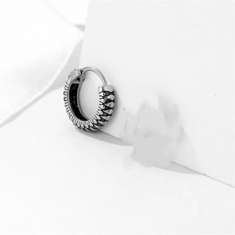 Silver titanium steel geometric twist earrings with round sports-style elements