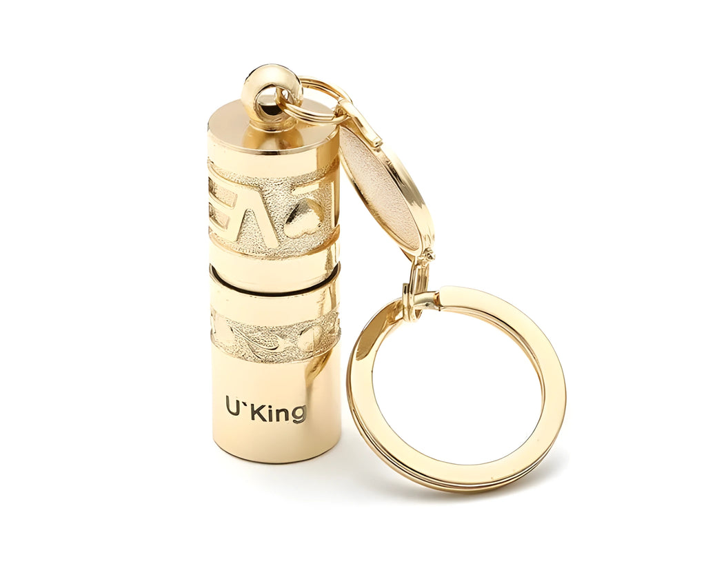 Gold-coloured zinc alloy waterproof mini LED keychain flashlight on a keyring.