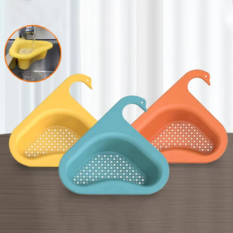 Household sink hanging fruit and vegetable drain basket in green plastic, clipped onto sink rim with slotted base