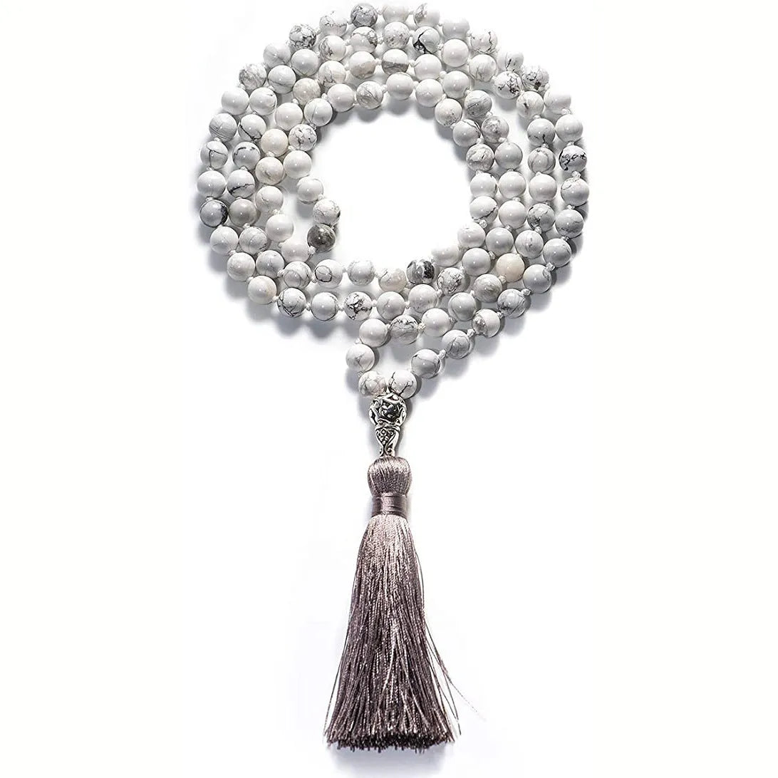 Long agate and amethyst tassel necklace with geometric beads in multiple colours on a 95-100cm chain.