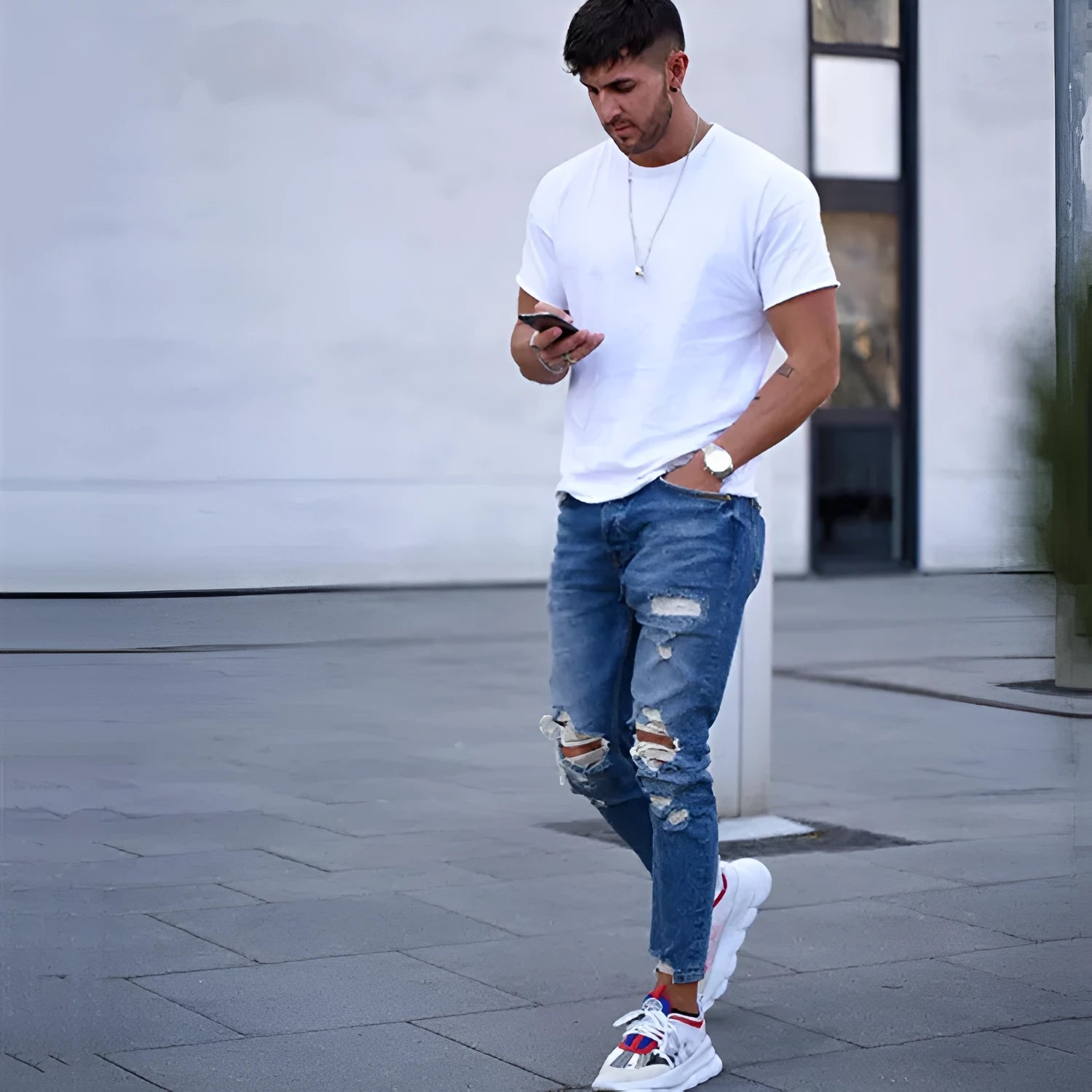 Men's distressed jeans with holes in deep blue cotton denim fabric