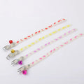 Cat wearing luminous collar with night illumination and metal bell on adjustable silicone chain