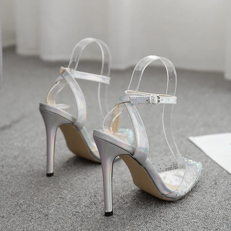 Women's pointed toe diamond sandals with a stiletto heel and PVC upper.
