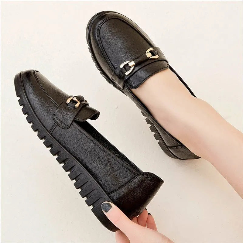 Black women's casual leather pumps with a round toe and low flat heel