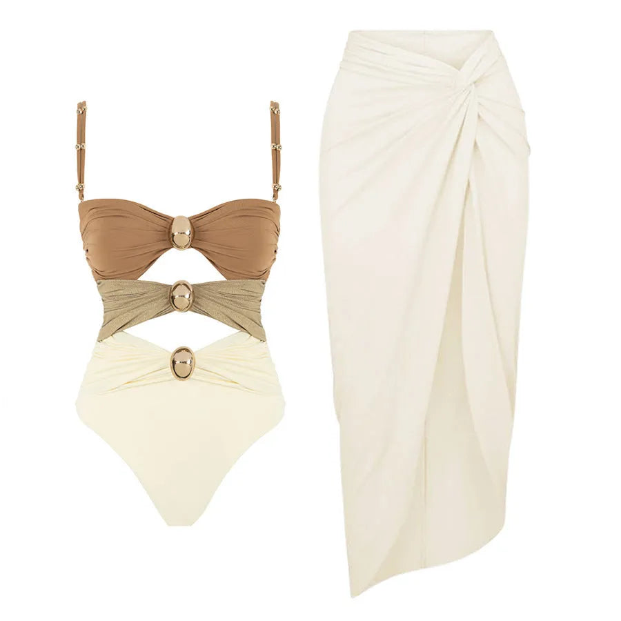 Women's solid colour one-piece swimsuit with gold button and matching skirt in black, blue, brown, or pink.