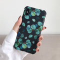 Black silicone iPhone case with a raised leaf pattern on the back.