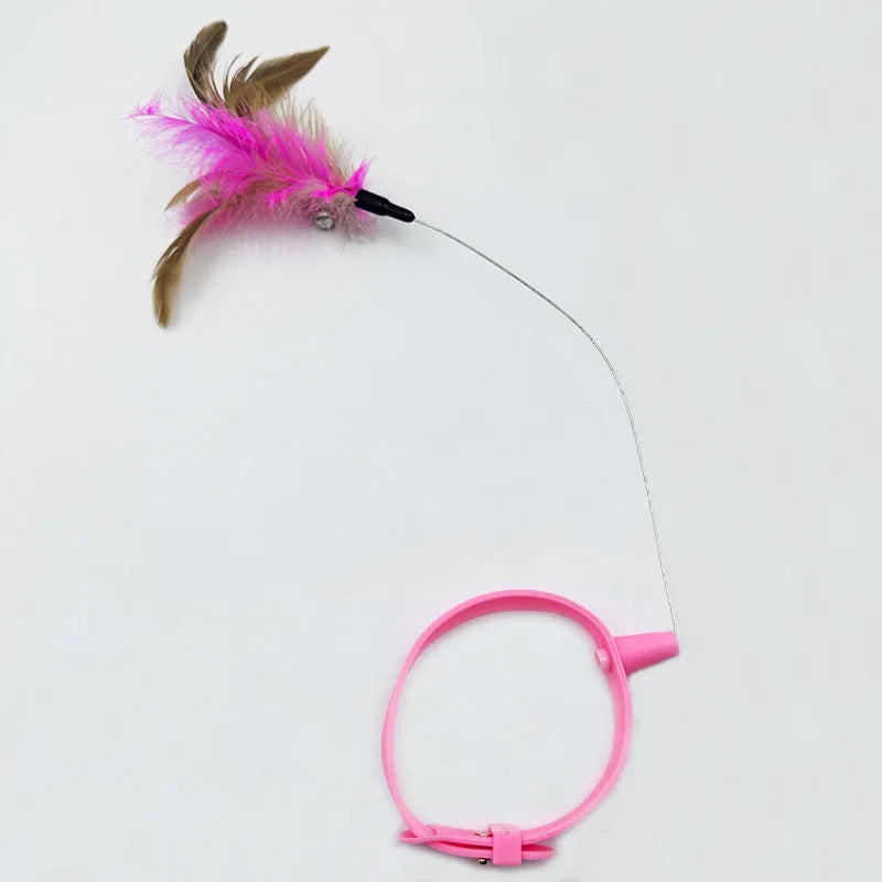 Blue collar cat teaser toy with feather and bell attachment on adjustable strap