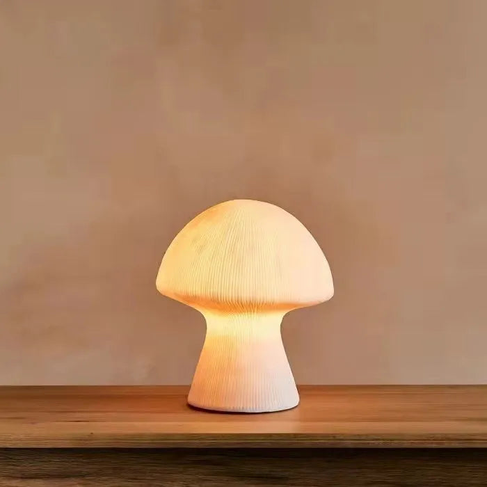 Nordic style handmade sandstone bedside table lamp with adjustable three-color light on a bedroom side table