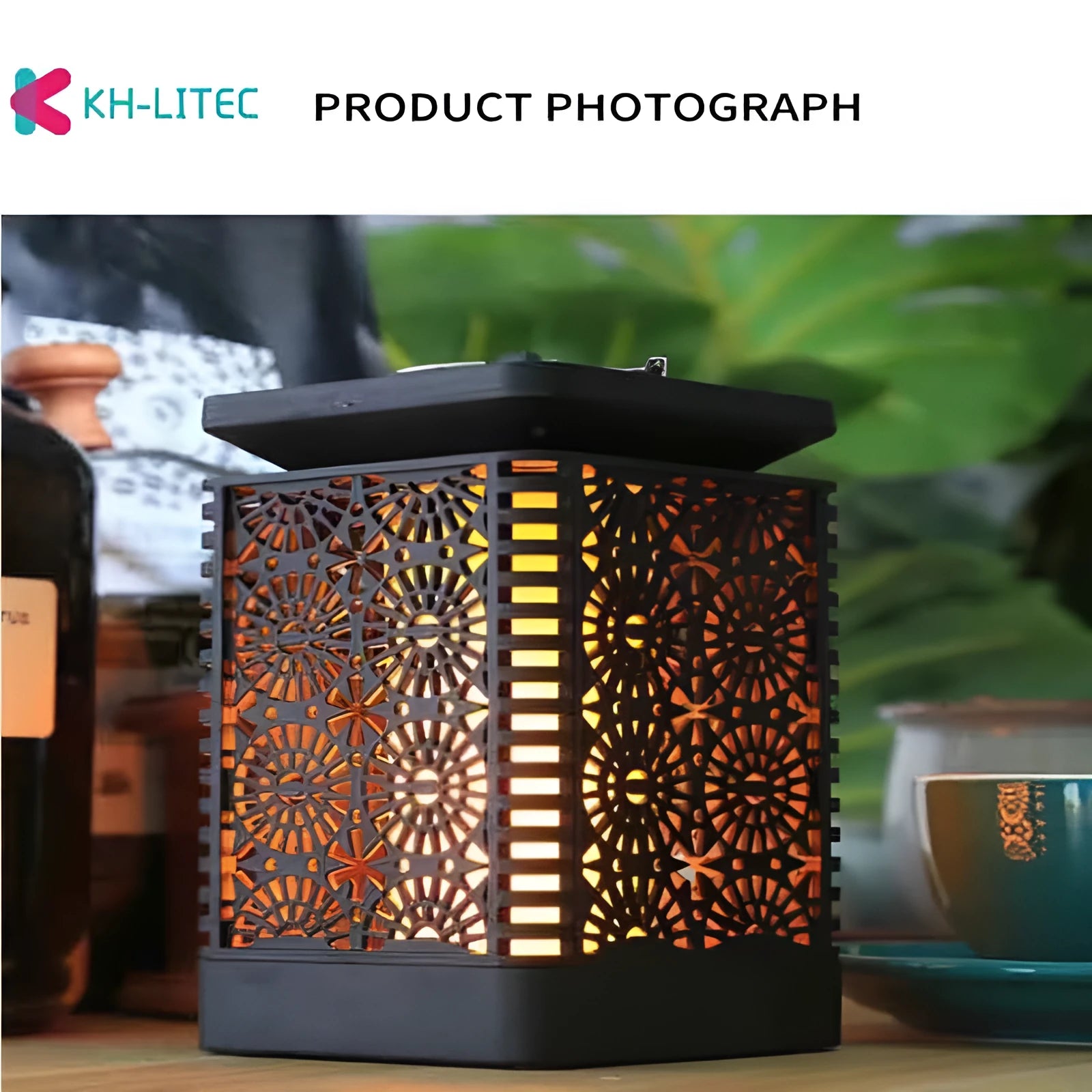 Black solar-powered LED hanging torch light with flickering flame effect for outdoor garden decoration.